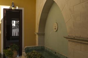 a swimming pool in a building with a door at B&B Sei Stelle in Sulmona