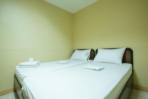 Postel nebo postele na pokoji v ubytování GV Hotel - Talisay City
