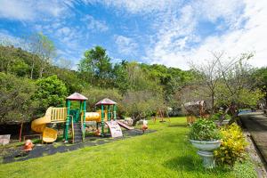 a park with a playground with a slide at Maylin B&B in Xinshe