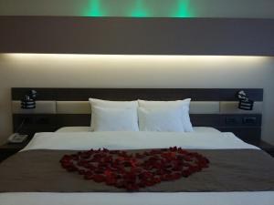 Postel nebo postele na pokoji v ubytování Hotel Scapino