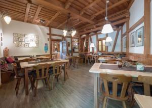 a dining room with wooden tables and chairs at Hotel Braun in Fahr