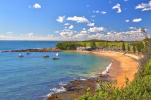 a view of a beach with boats in the water at Joy's Hideaway in Terrigal