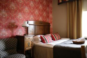 Łóżko lub łóżka w pokoju w obiekcie Boutique Hotel Yöpuu