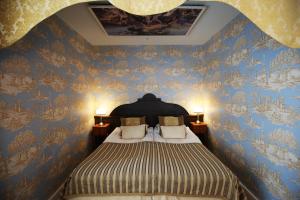 Postel nebo postele na pokoji v ubytování Boutique Hotel Yöpuu