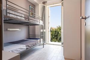 Postel nebo postele na pokoji v ubytování Appartamenti Rimembranze