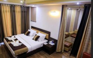 Postel nebo postele na pokoji v ubytování Hotel Ravine Palace