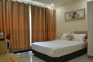 Postel nebo postele na pokoji v ubytování My Inn Hotel Kota Samarahan