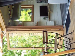 a view from the top of a room with a window at Tiny House "Les Vallées" in Saint-Quentin-sur-le-Homme
