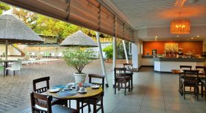 A restaurant or other place to eat at Cresta Sprayview Victoria Falls