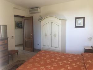 Postel nebo postele na pokoji v ubytování Villa Loreto