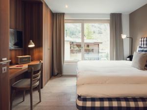Postel nebo postele na pokoji v ubytování OVERLOOK Lodge by CERVO Zermatt