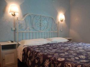Postel nebo postele na pokoji v ubytování Casa Cleo
