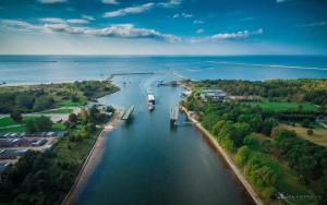 an aerial view of a river with boats in it at Hostel Brize in Liepāja