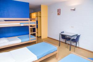 A bed or beds in a room at Hostel Blauwput Leuven