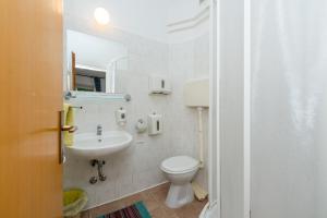 Koupelna v ubytování Apartments Giardino
