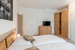 Postel nebo postele na pokoji v ubytování WN Rooms