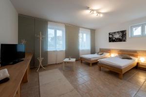 Postel nebo postele na pokoji v ubytování WN Rooms
