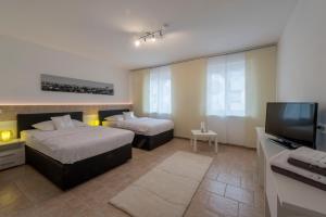 Postel nebo postele na pokoji v ubytování WN Rooms