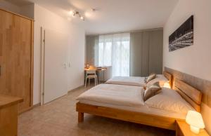 Postel nebo postele na pokoji v ubytování WN Rooms