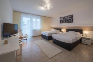 Postel nebo postele na pokoji v ubytování WN Rooms
