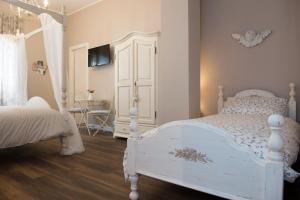 Postel nebo postele na pokoji v ubytování Magnolia St.Peter's Suites