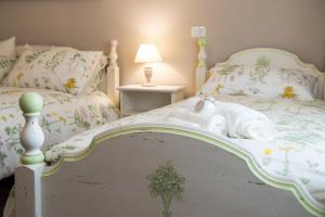 Postel nebo postele na pokoji v ubytování Magnolia St.Peter's Suites