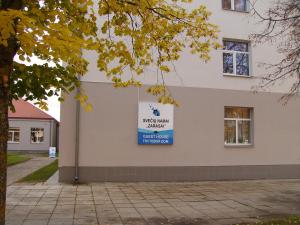 a sign on the side of a building at Apgyvendinimo įstaiga KORNEALITA-ZARASAI in Zarasai