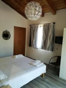 Letto o letti in una camera di I Gelsi e i Castagni