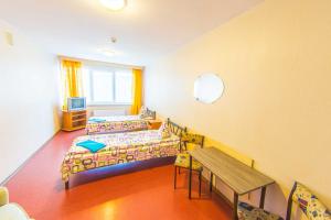 En eller flere senge i et værelse på Hostel Brize
