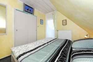 Postel nebo postele na pokoji v ubytování Ferienwohnungen Haus Sternenlicht