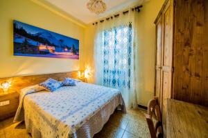 a bedroom with a bed and a window at La Belle Epoque in Aosta