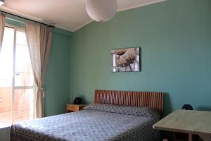 מיטה או מיטות בחדר ב-Le Ninfe Bed and Breakfast