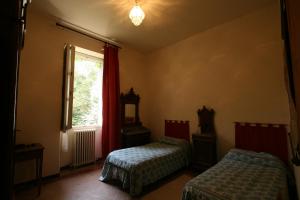 Posteľ alebo postele v izbe v ubytovaní Agriturismo Villa Gropella