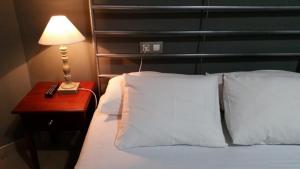 
Кровать или кровати в номере Hostal LK Barcelona
