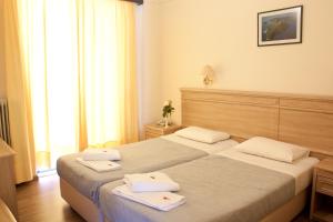 Postel nebo postele na pokoji v ubytování Hotel Nydri Beach