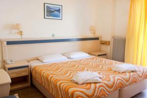 Postel nebo postele na pokoji v ubytování Hotel Nydri Beach