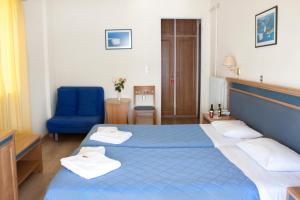 Postel nebo postele na pokoji v ubytování Hotel Nydri Beach