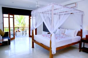 Un pat sau paturi într-o cameră la Malu Banna