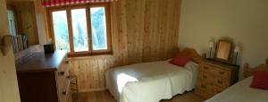 A bed or beds in a room at Chalet Etoile