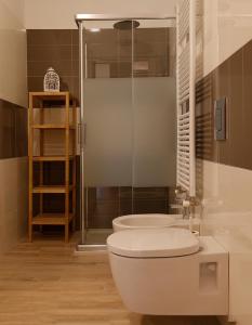 a bathroom with a toilet and a shower and a sink at C.A.V. B&B Curiel20 in San Donato Milanese +41 photos