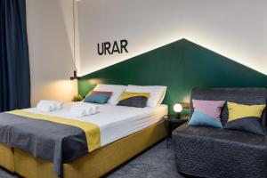 
a hotel room with two beds and a lamp at Swanky Mint Hostel in Zagreb

