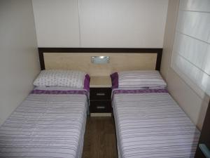 Ein Bett oder Betten in einem Zimmer der Unterkunft Camping Moraira