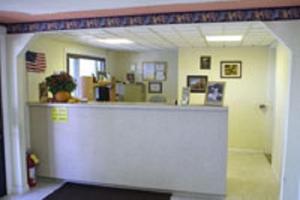 a lobby with a counter in a room at Appalachian Motel in Vernon