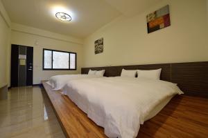 Postel nebo postele na pokoji v ubytování Shan Jhong You You B&B + 8 fotografií