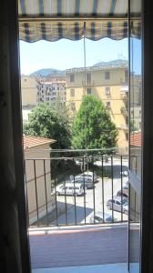 a window with a view of a parking lot at La Dimora di Nadine in La Spezia