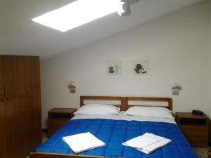 מיטה או מיטות בחדר ב-Hotel Gasperoni