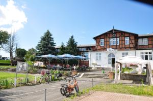 a group of bikes parked in front of a building at Pension Zum Alten Fährhaus in Rostock +57 photos