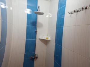 a bathroom with a shower and a sink at Kasbah Red Castel Hostel in Marrakech