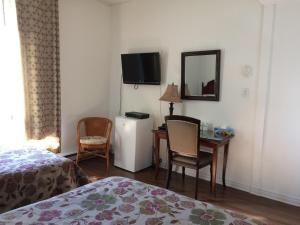 Postel nebo postele na pokoji v ubytování Hotel Bon Accueil