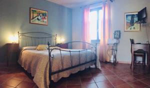A bed or beds in a room at Rosso Di Sera
